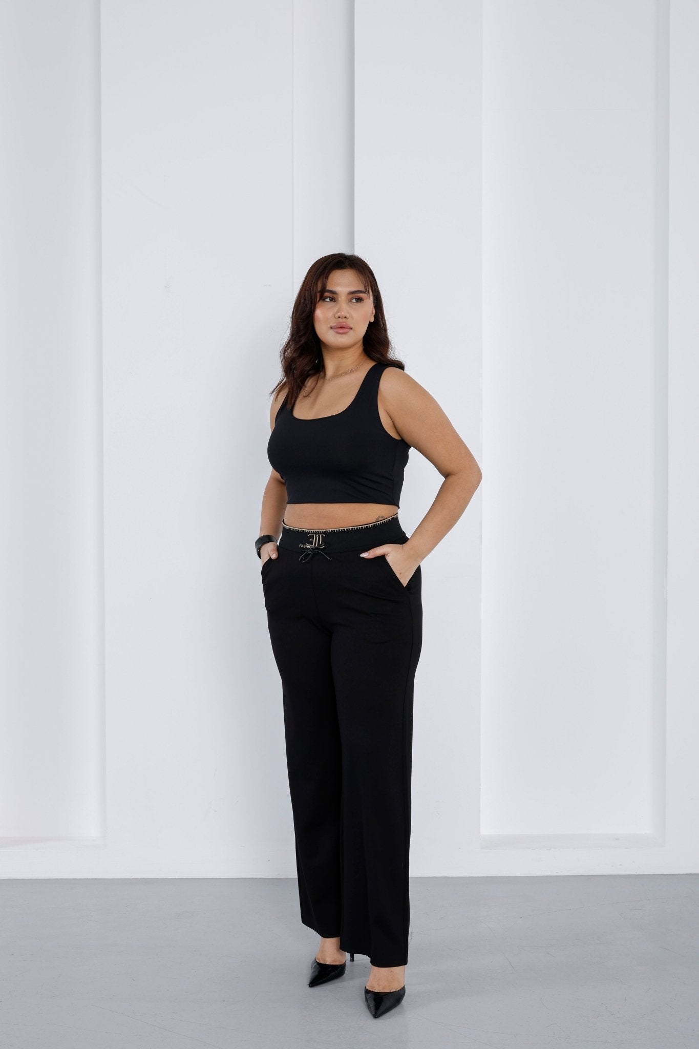 Wholesale Gold embroidered ribbed waistband detail on luxury wholesale ponte pants - Elitline front 3