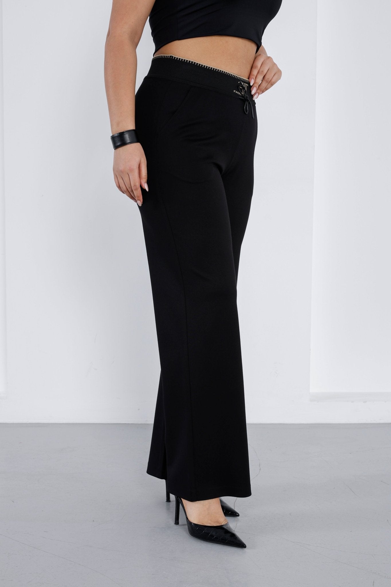 Wholesale Gold embroidered ribbed waistband detail on luxury wholesale ponte pants - Elitline front 2