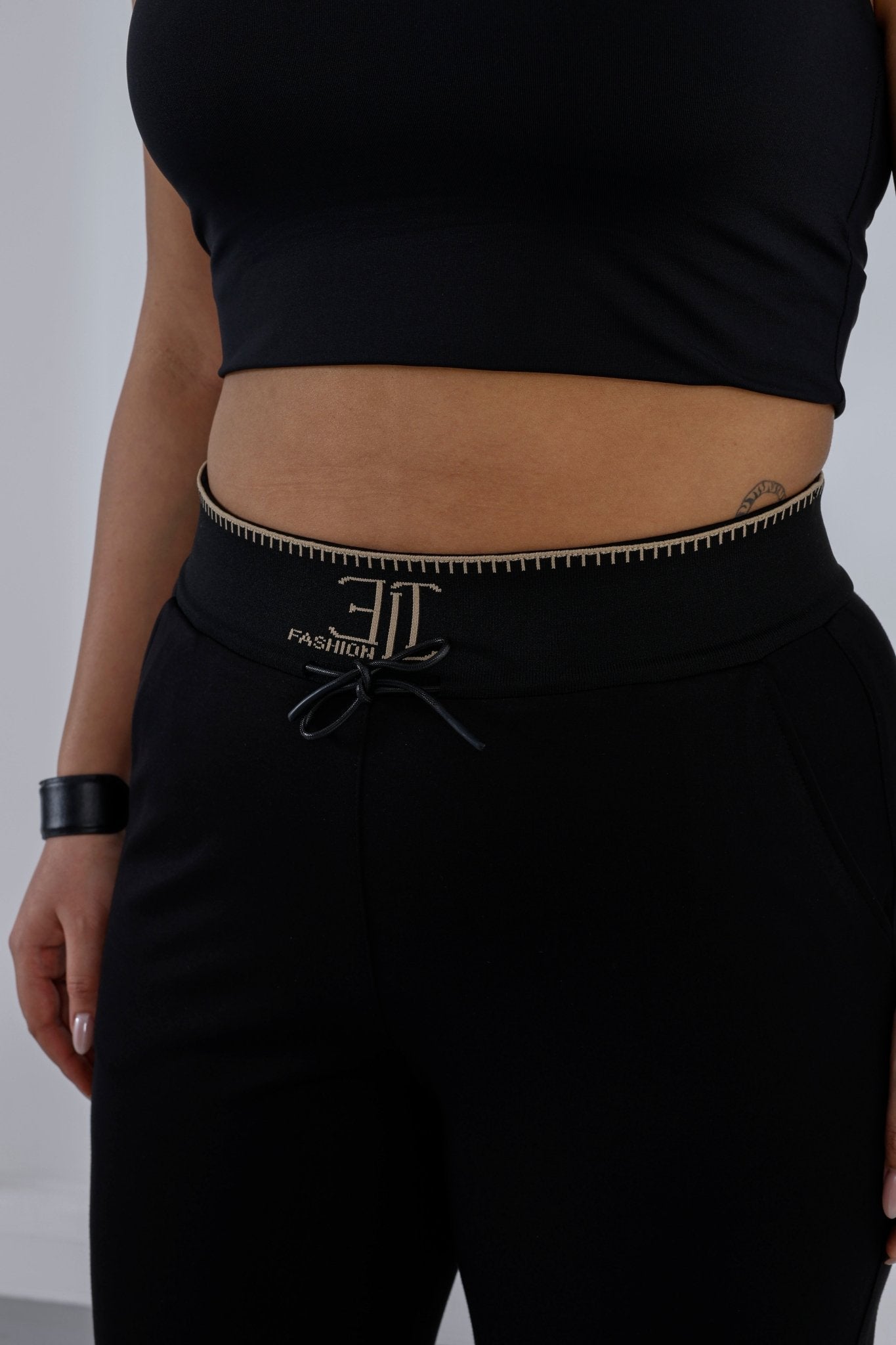 Wholesale Gold embroidered ribbed waistband detail on luxury wholesale ponte pants - Elitline details on waistband