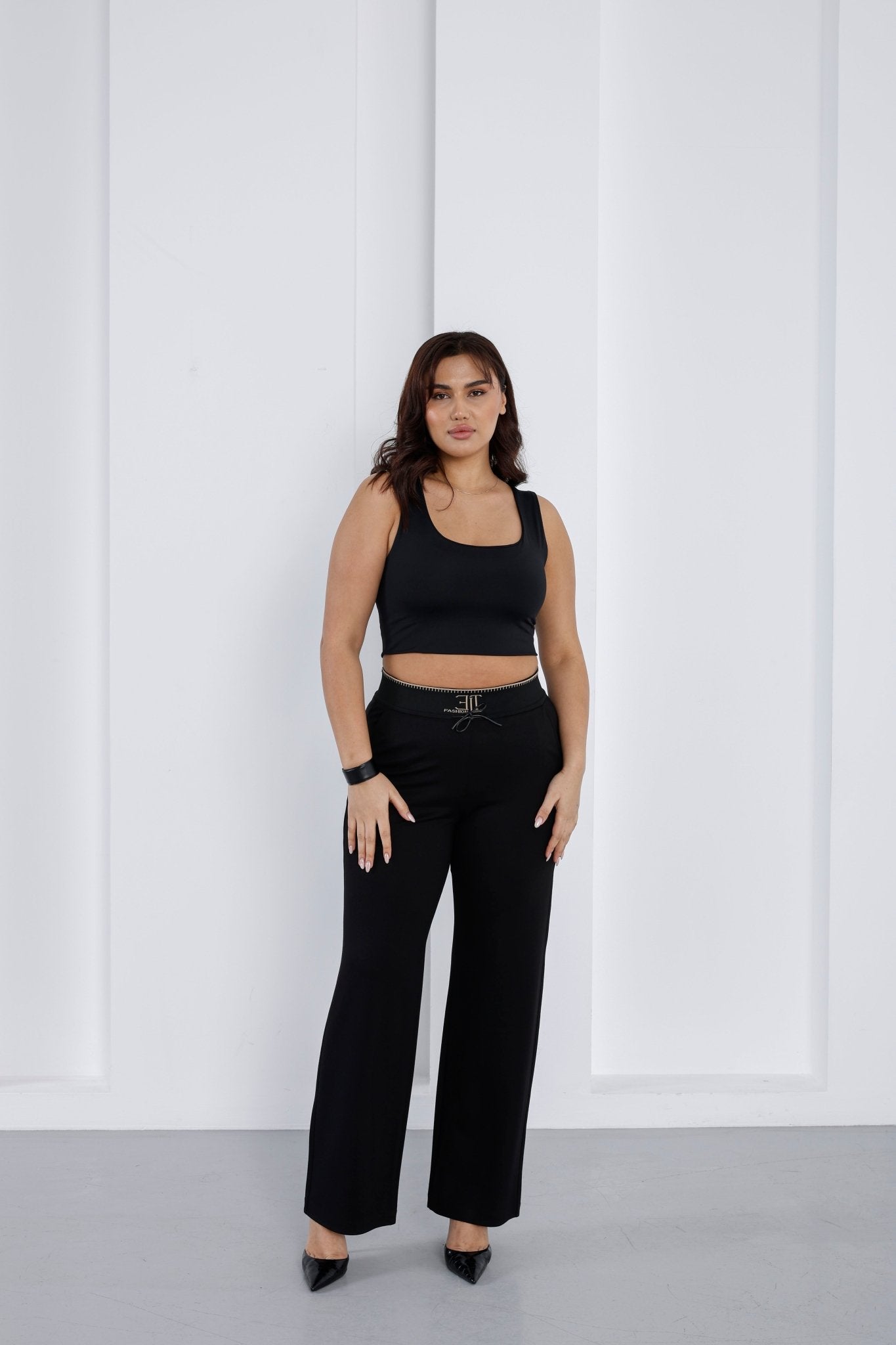 Wholesale Gold embroidered ribbed waistband detail on luxury wholesale ponte pants - Elitline front 2